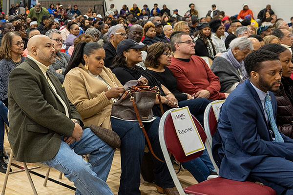 An open forum is taking place with many residents in seats hearing the upcoming offerings for their community.